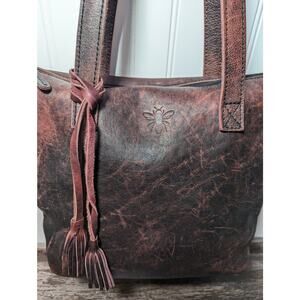 Annelle Multicolor Distressed Leather Bucket Bag with Tassel Accent